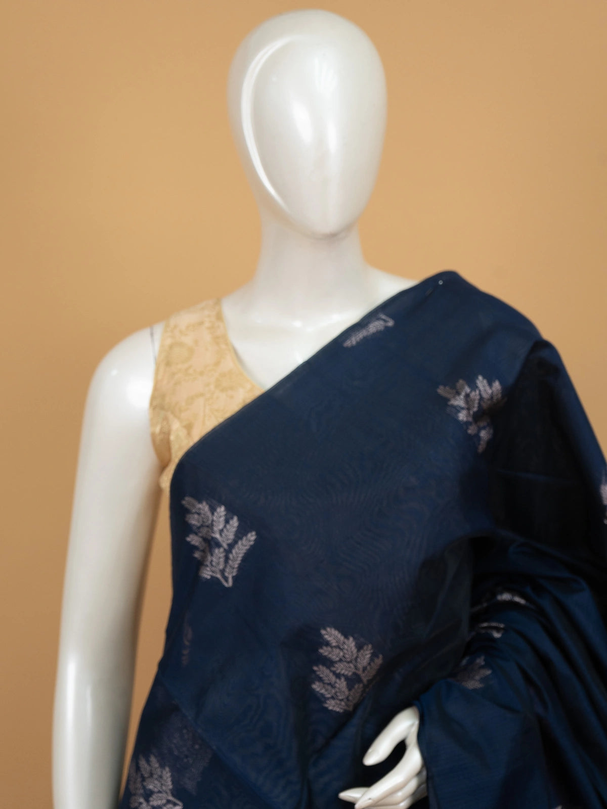 Navy blue silk cotton saree with silver butta motifs and contrast maroon pallu and border