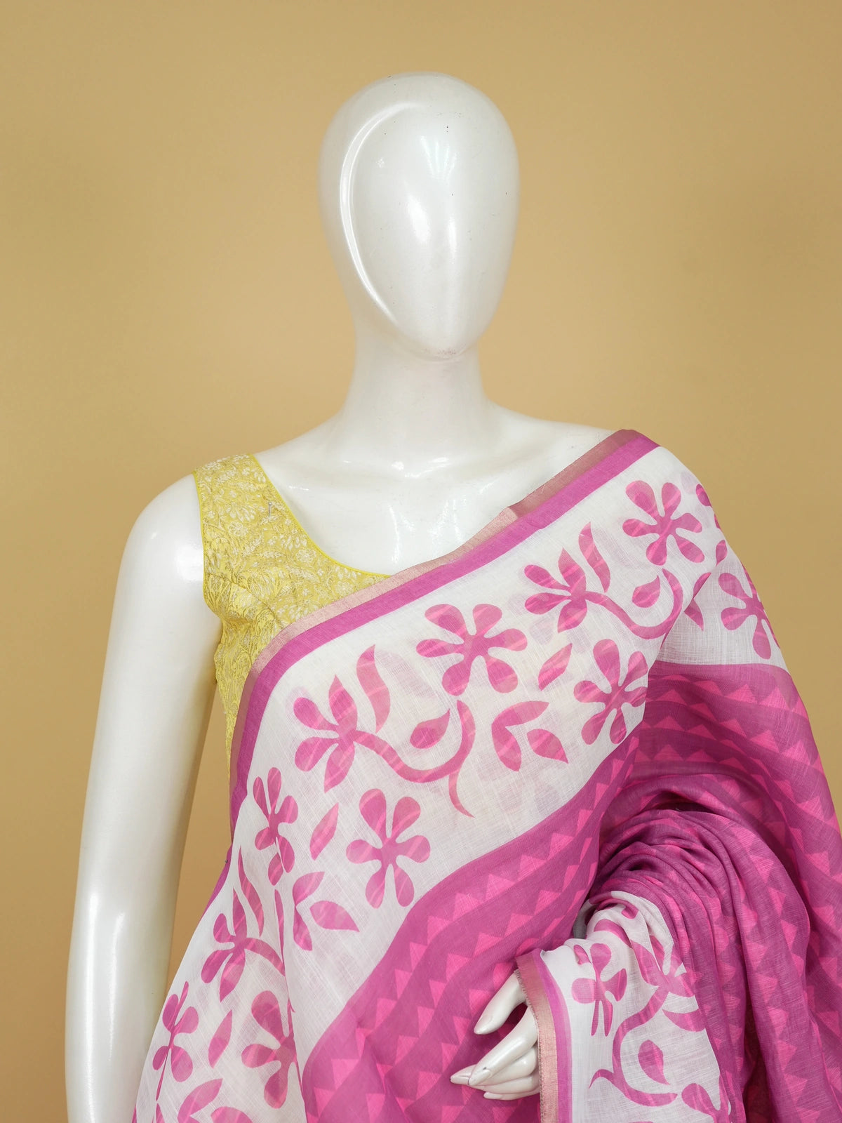 Pink and white linen cotton saree with floral print pallu and gold zari border