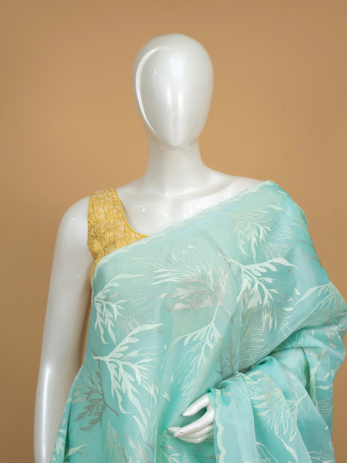Aqua sea green organza designer saree with silver leaf embroidery and scalloped border