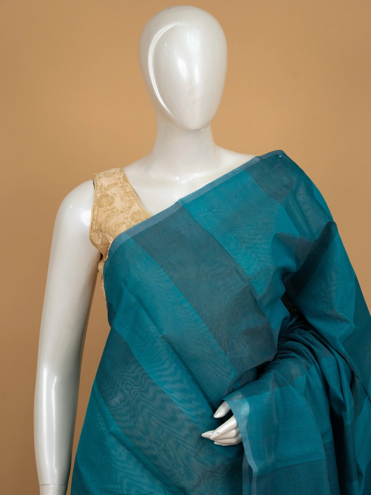 Teal blue silk cotton saree with tonal checks and contrast dark navy border