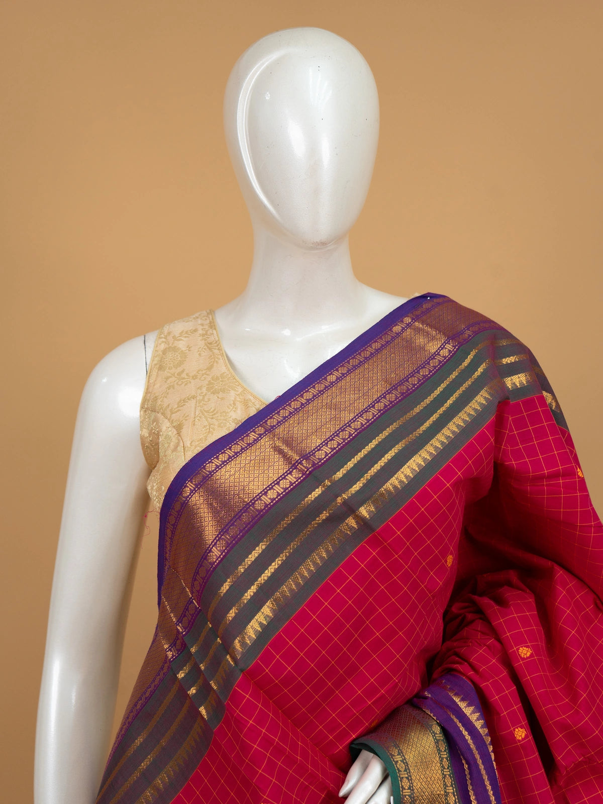 Pink Chettinad cotton saree with checked body, woven buttas, and contrast purple gold zari border