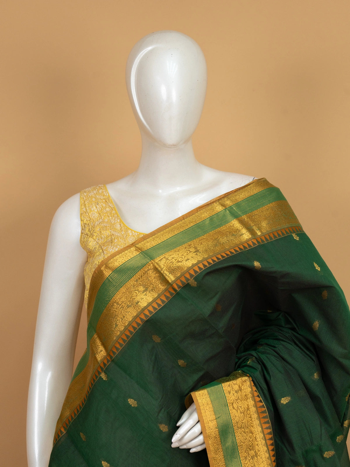 Dark green Chettinad cotton saree with gold zari temple border and woven zari pallu