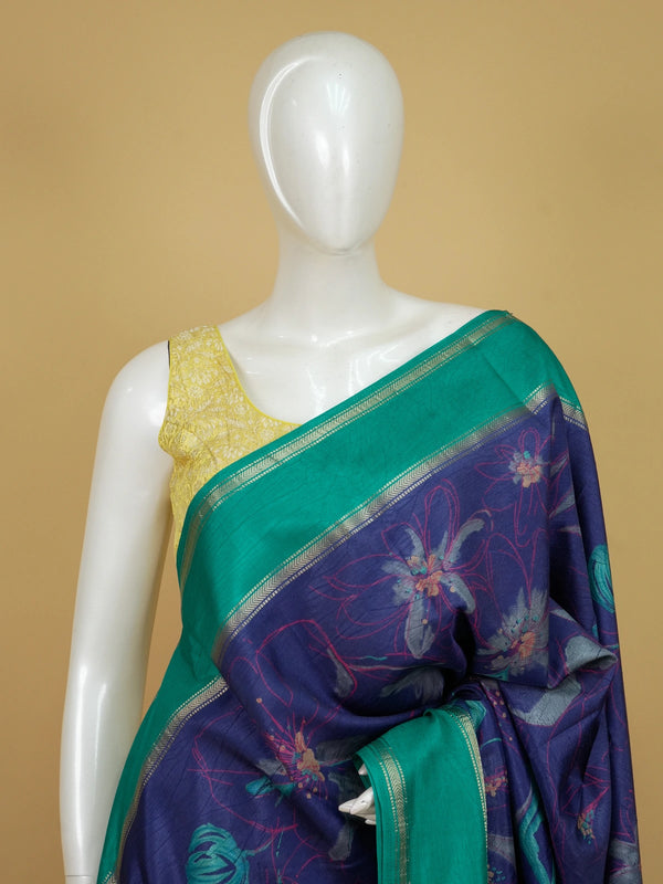 Navy-blue Dola silk saree with floral print and contrast teal-green zari border