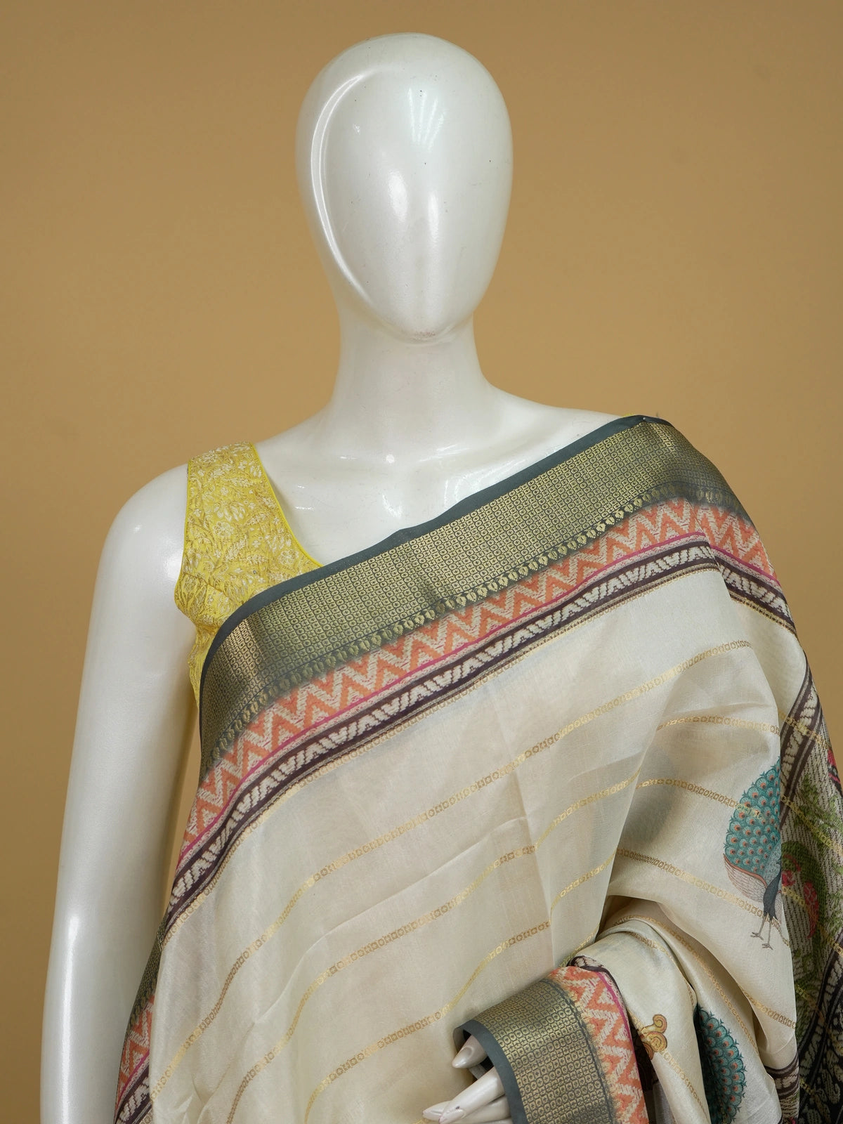 Cream and grey semi tussar saree with gold zari stripes and folk-art printed pallu