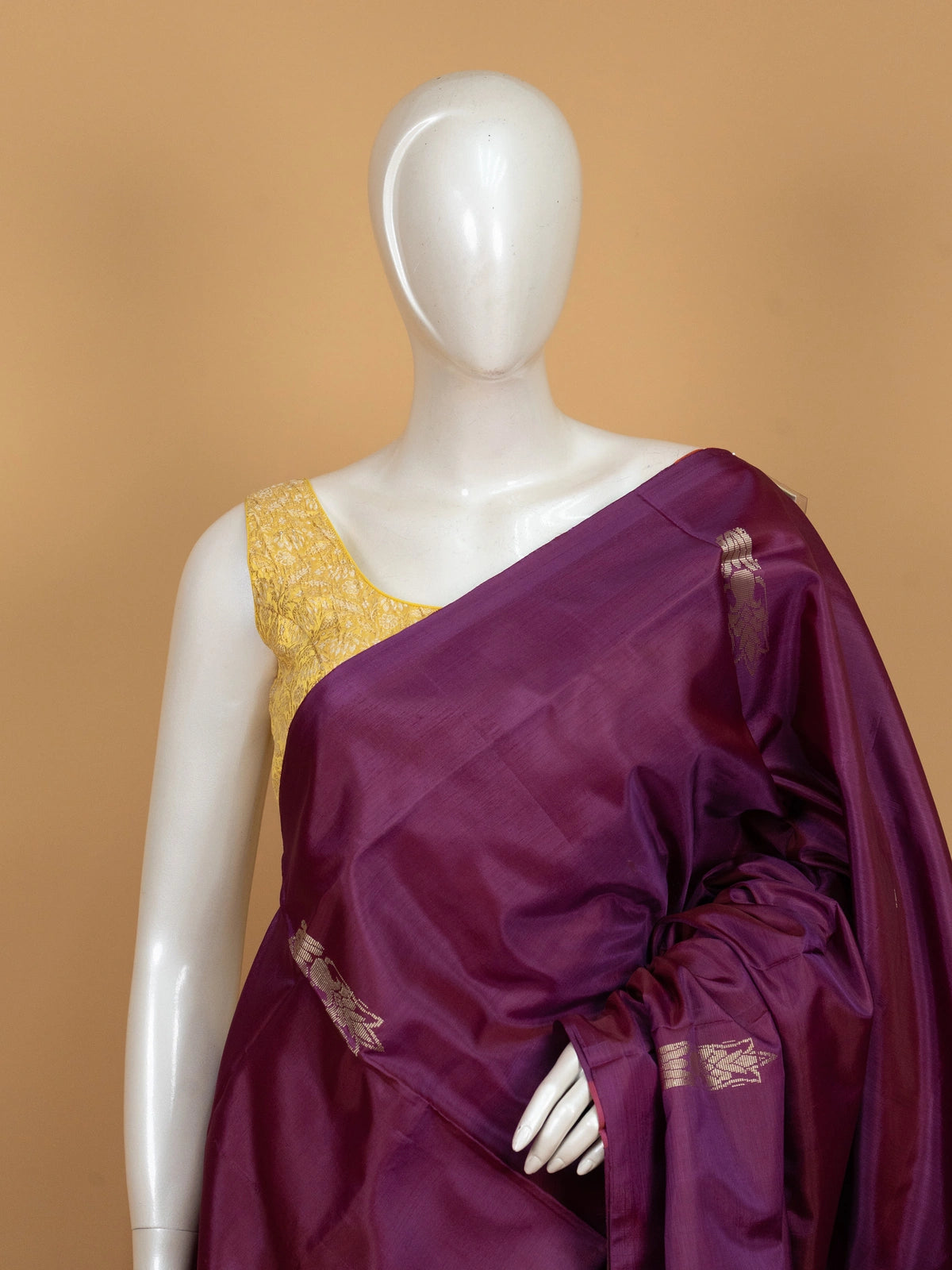 Purple banana silk saree with contrast green zari border and striped pallu