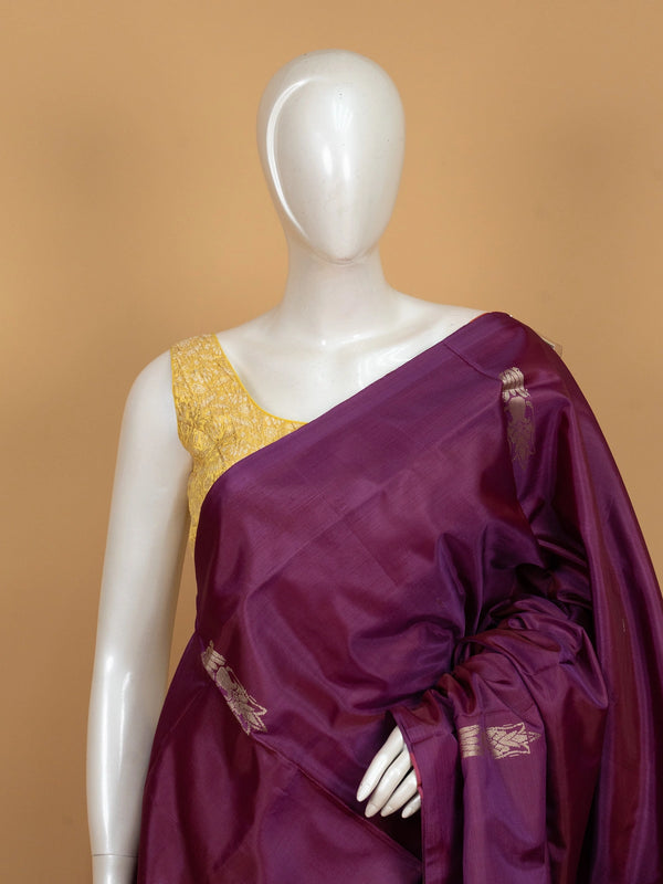 Purple banana silk saree with contrast green zari border and striped pallu