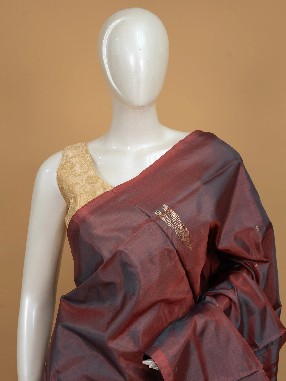Maroon and charcoal grey banana silk saree with gold zari buttas and peacock and elephant motif pallu
