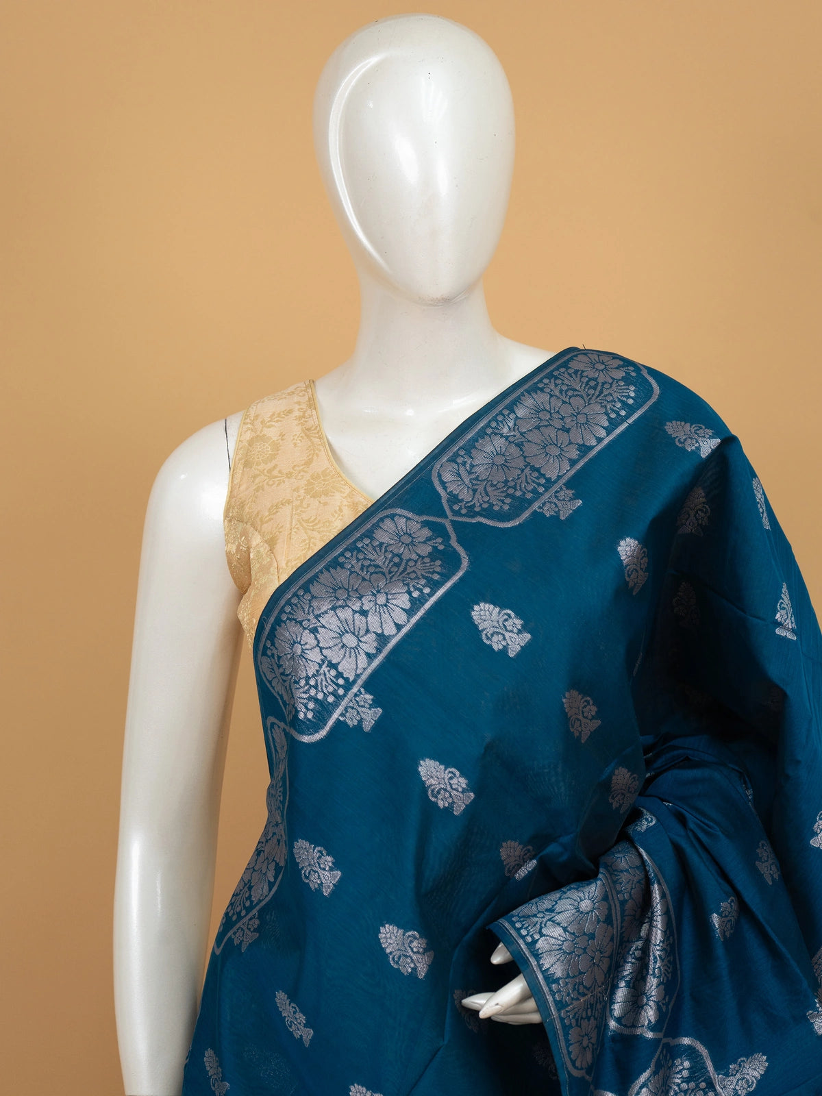 Peacock blue silk cotton saree with silver zari buttas and diamond-patterned zari border and pallu