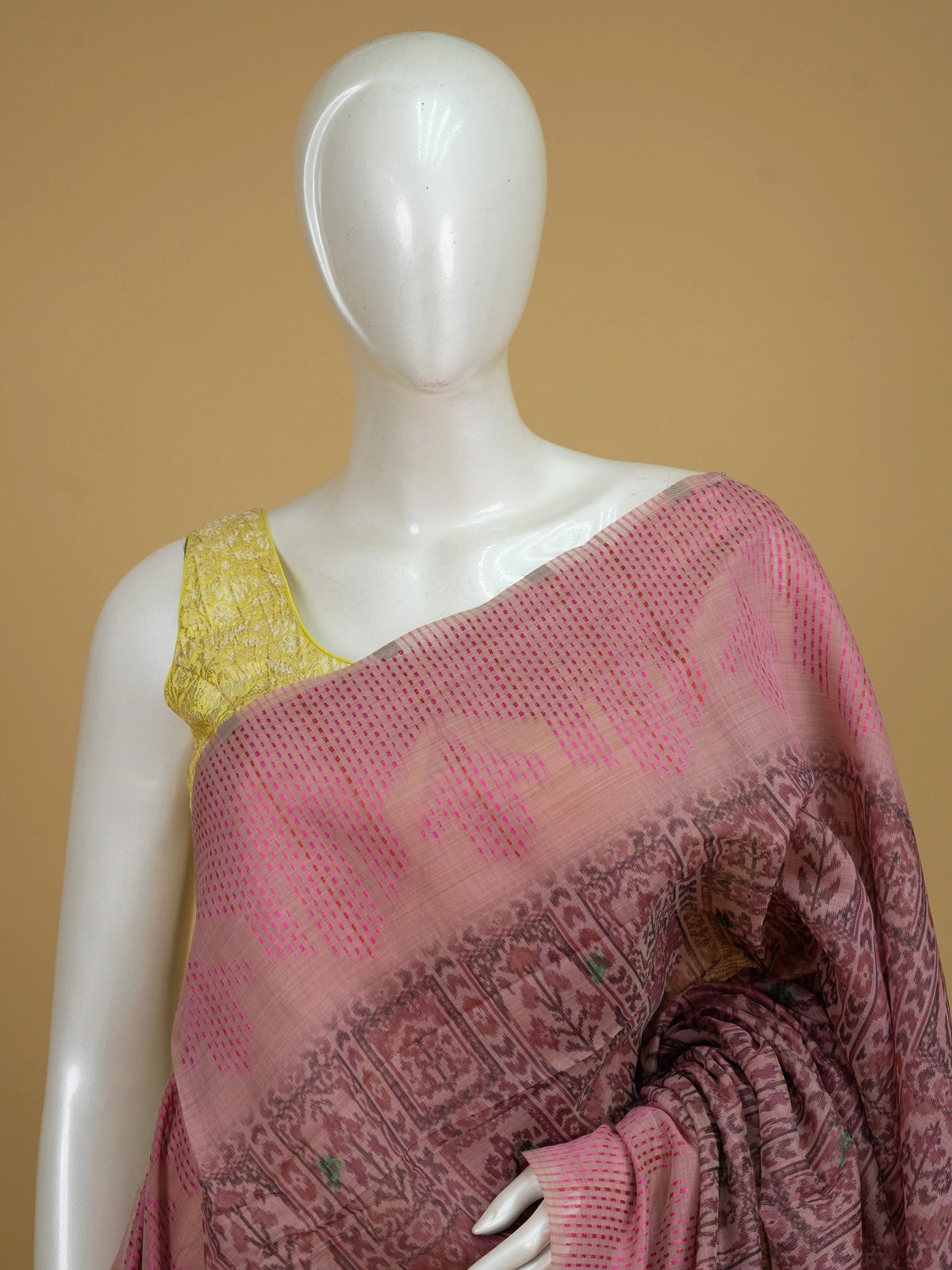 Dusty pink linen cotton saree with ikat patola body and Madhubani bird pallu