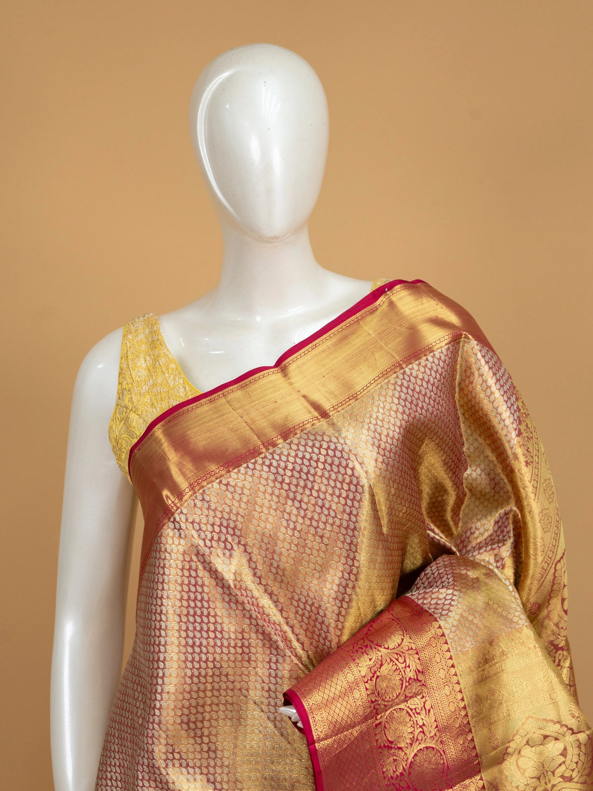 Gold pure Kanchipuram silk saree with contrast pink zari border and ornate woven pallu