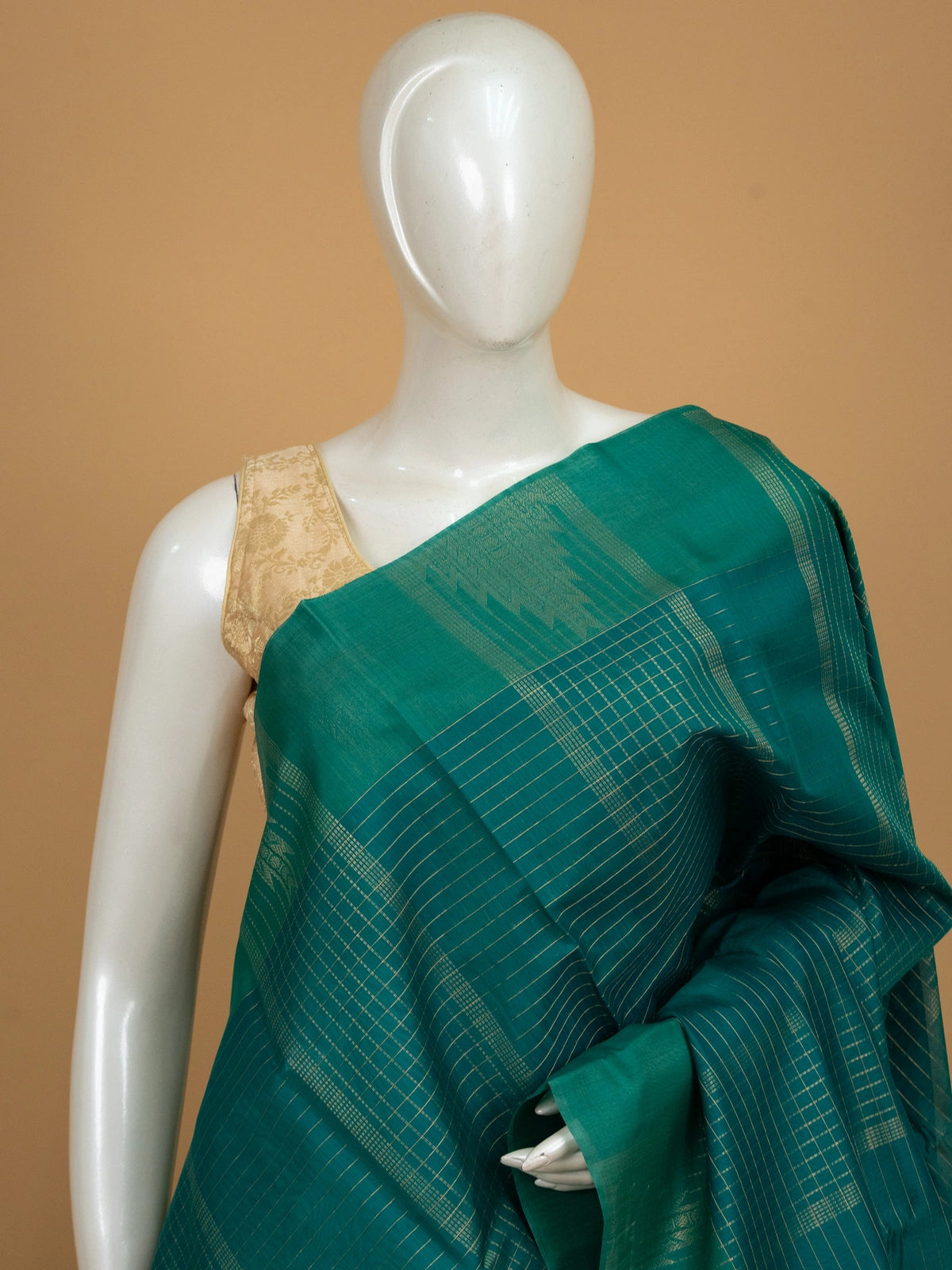 Teal green pure silk cotton saree with gold zari checks and contrast temple zari border