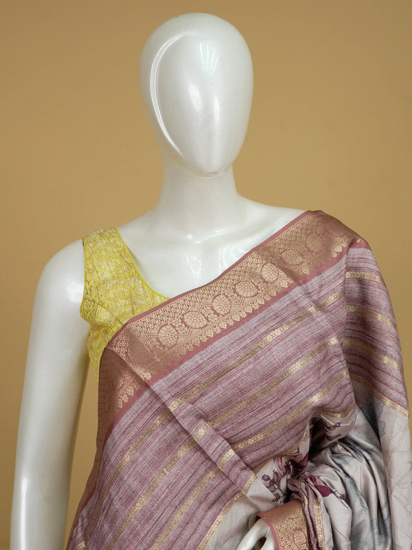 Cream and mauve floral semi tussar saree with gold zari contrast border and printed pallu