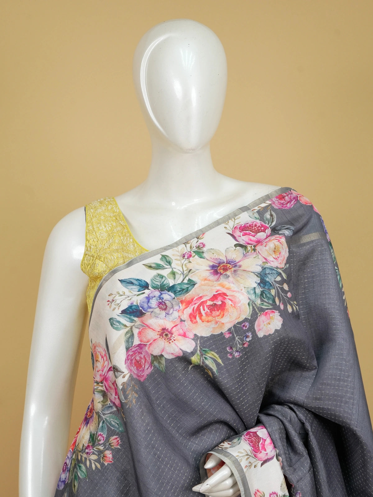 Grey semi tussar saree with cream floral borders, multicolour floral prints and a zari-dot textured body