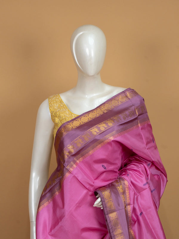 Pink banana silk saree with contrast purple gold zari border and buttis