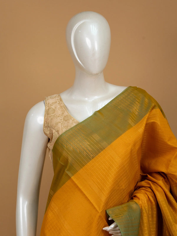 Mustard yellow pure silk cotton saree with olive green contrast zari border and golden pallu
