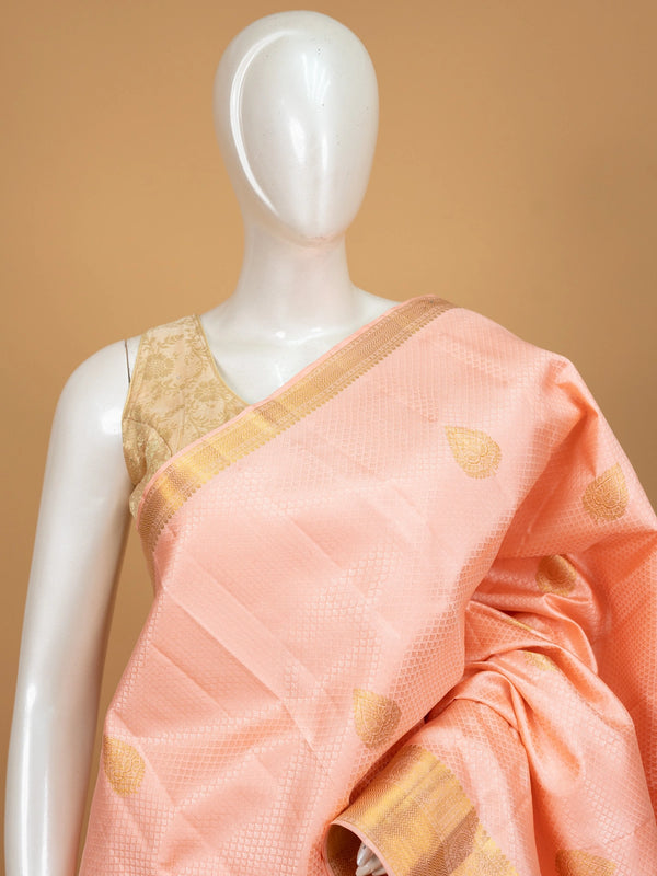 Peach pure Kanchipuram silk saree with gold zari buttas, contrast zari border and woven pallu