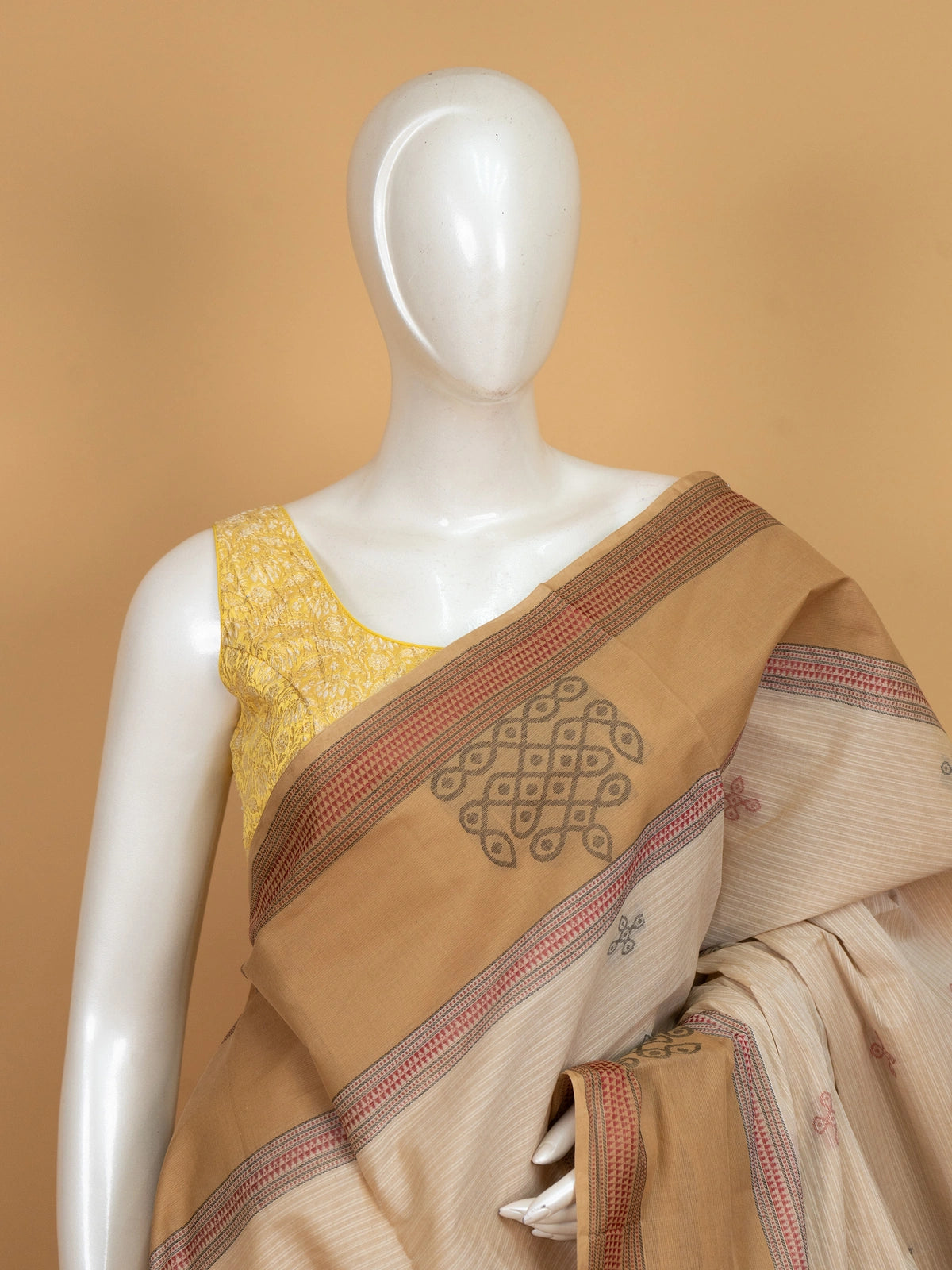 Beige and tan semi raw silk saree with contrast tan border and woven kolam motifs