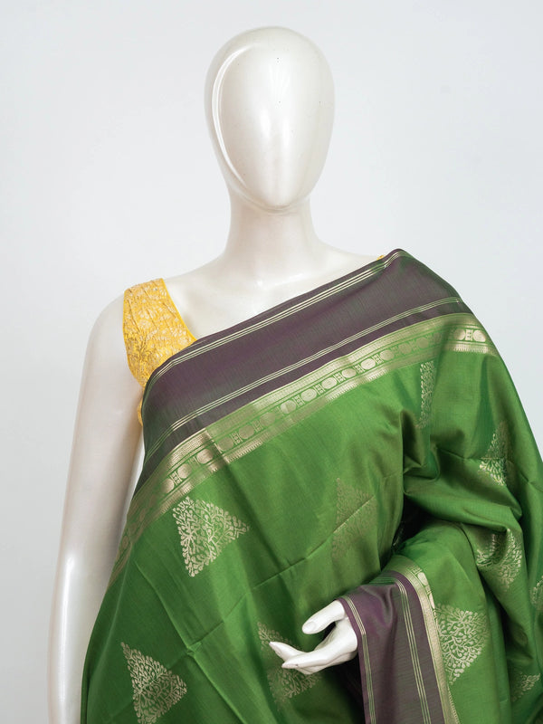 Green Kanchipuram fancy silk saree with contrast mauve zari border and triangular temple zari buttas