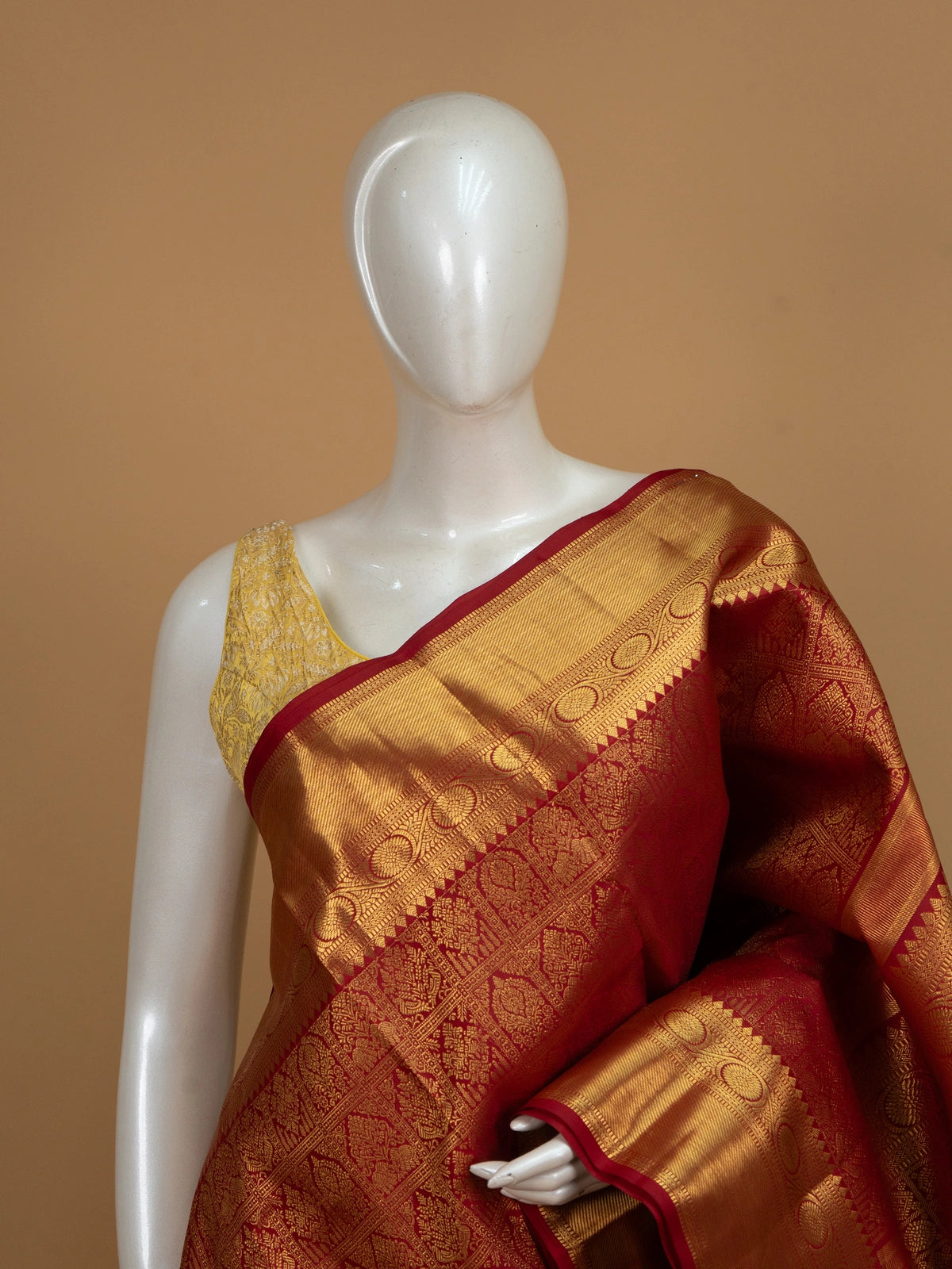 Red pure Kanchipuram silk saree with all-over gold zari brocade and wide contrast gold border
