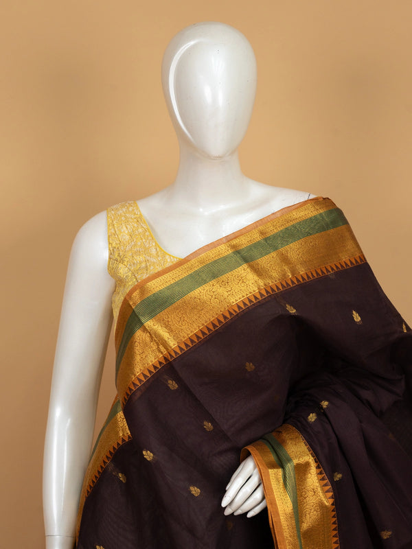 Maroon brown Chettinad cotton saree with mustard-gold zari border, green stripe accents and gold buti motifs