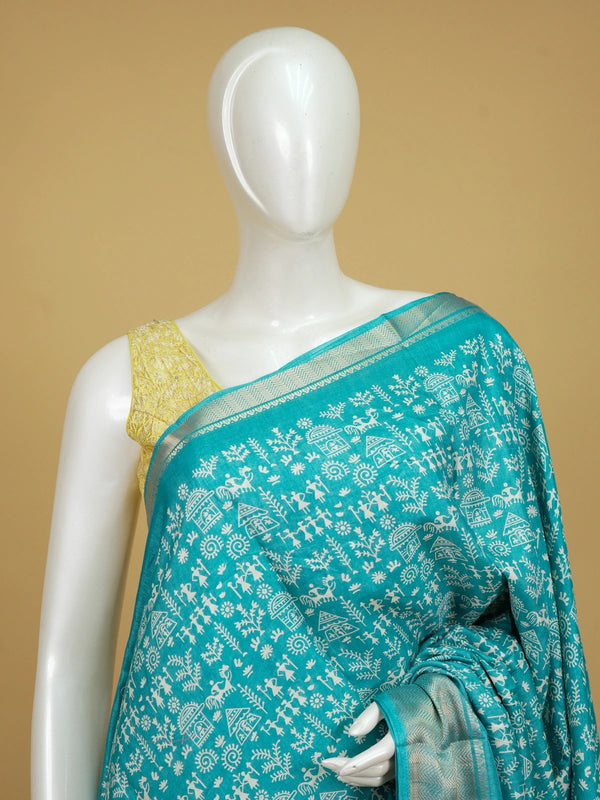 Teal blue designer saree with white Warli tribal print and gold zari border