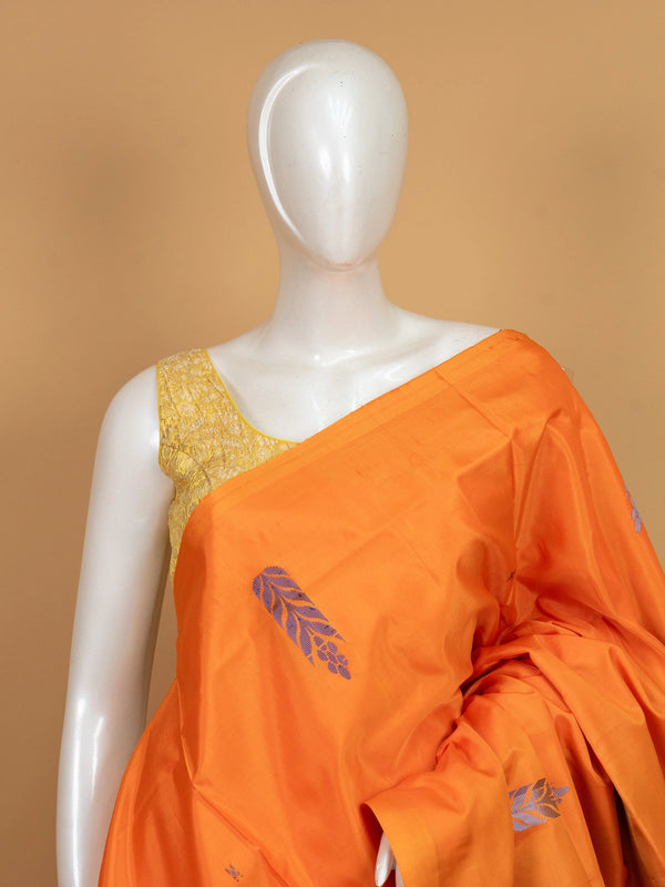 Orange banana silk saree with contrast blue pallu, woven buta motifs and silver zari leaf border