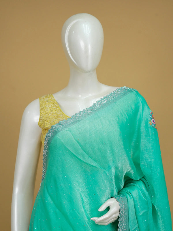 Sea green tissue designer saree with multicolour floral motifs and scalloped silver stone border