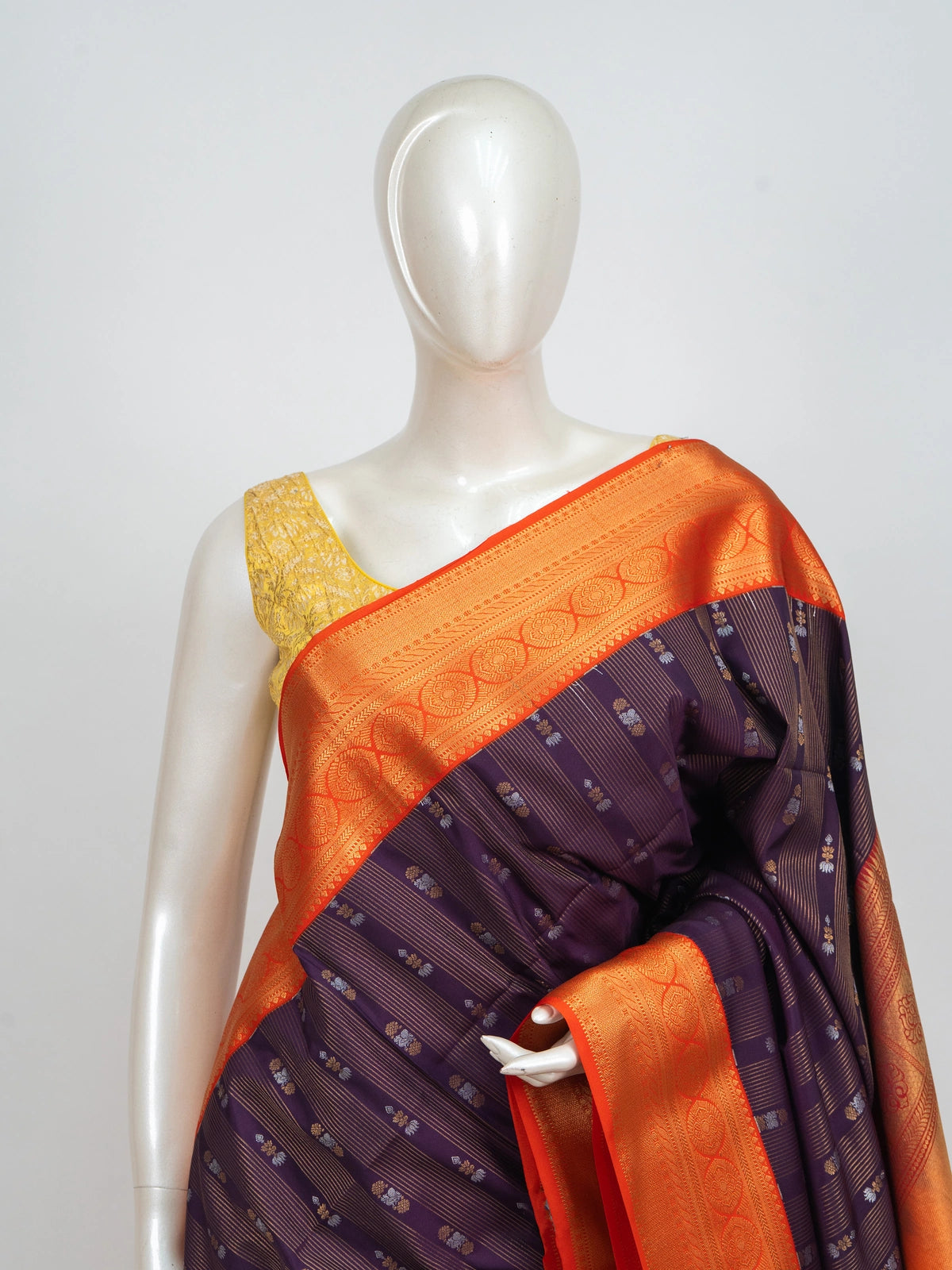 Purple Kanchipuram fancy silk saree with contrast orange gold zari border and brocade pallu