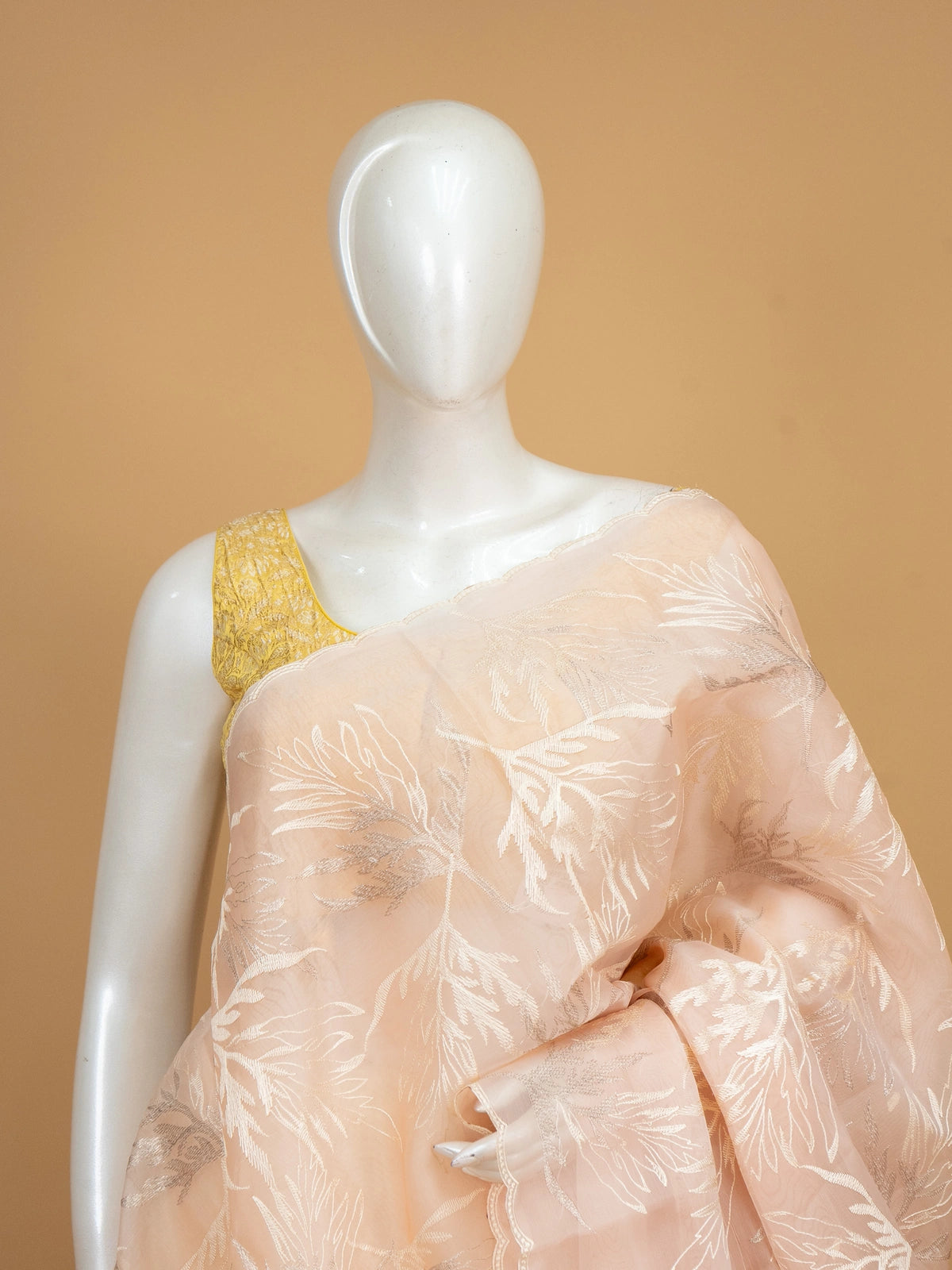 Soft peach organza designer saree with silver leaf embroidery and contrast yellow blouse