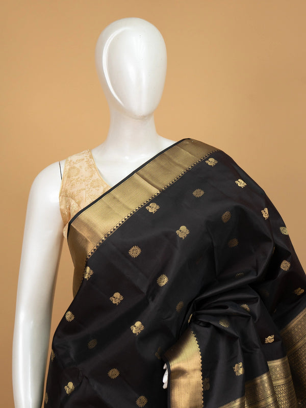 Black pure Kanchipuram silk saree with gold zari buttas and broad zari border