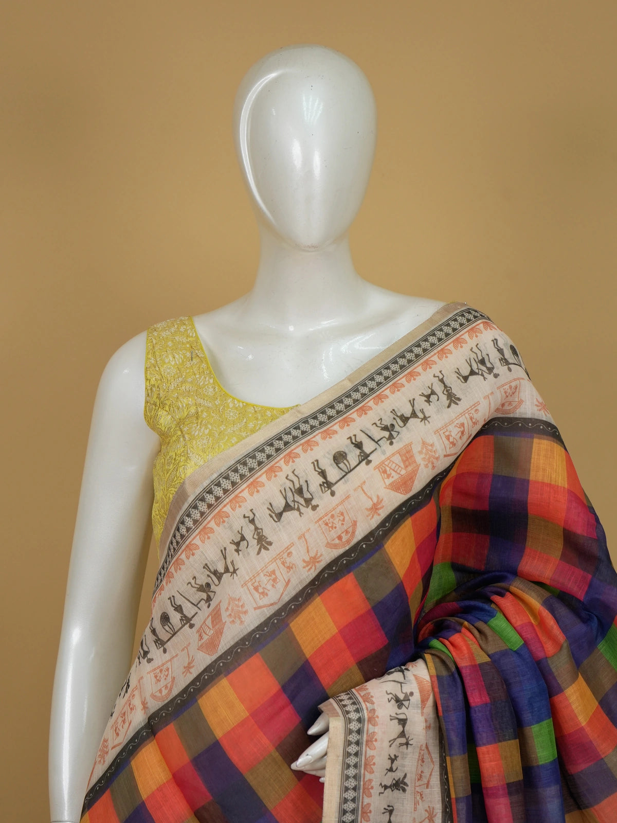 Multicolour checked linen cotton saree with Warli tribal print border and yellow blouse