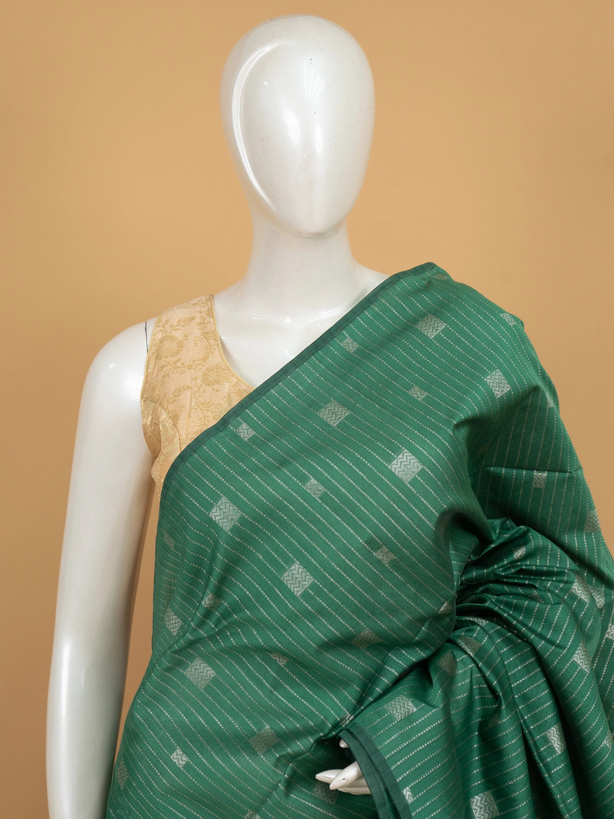 Green silk cotton saree with silver zari stripes and contrast magenta zari border and pallu