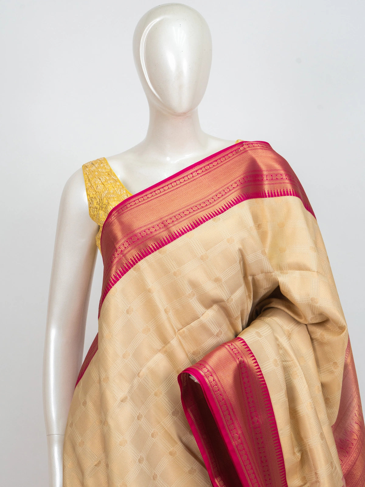 Cream Kanchipuram fancy silk saree with contrast pink gold zari border and woven pallu