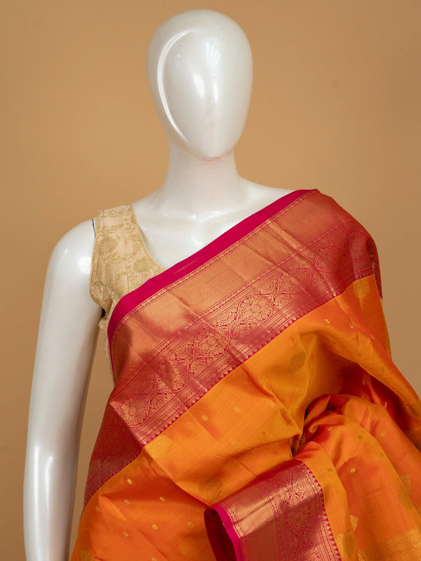 Orange and pink pure Kanchipuram silk saree with gold zari border and zari pallu
