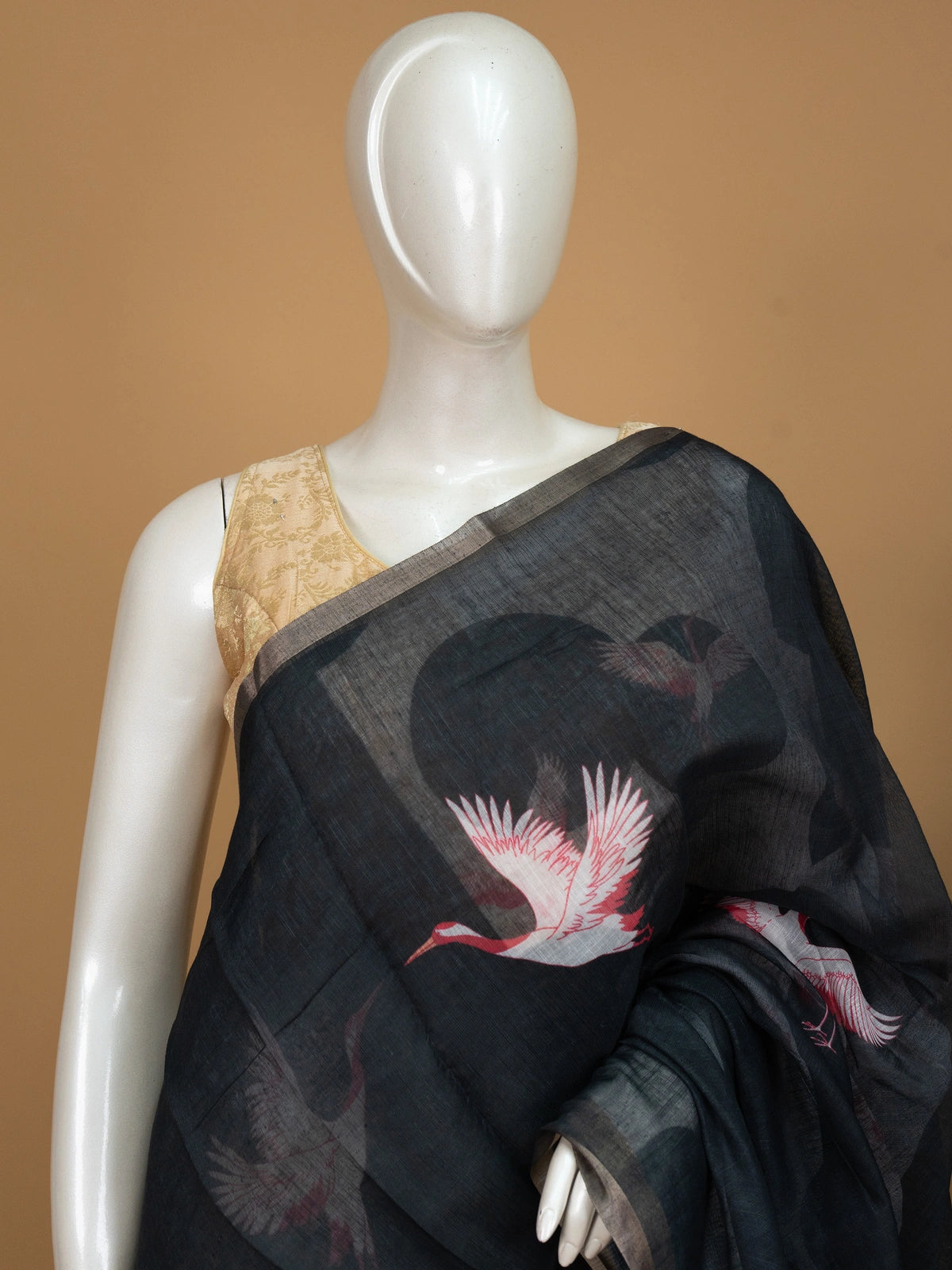 Black linen cotton saree with red and white crane prints, tonal circle motifs and a silver zari border