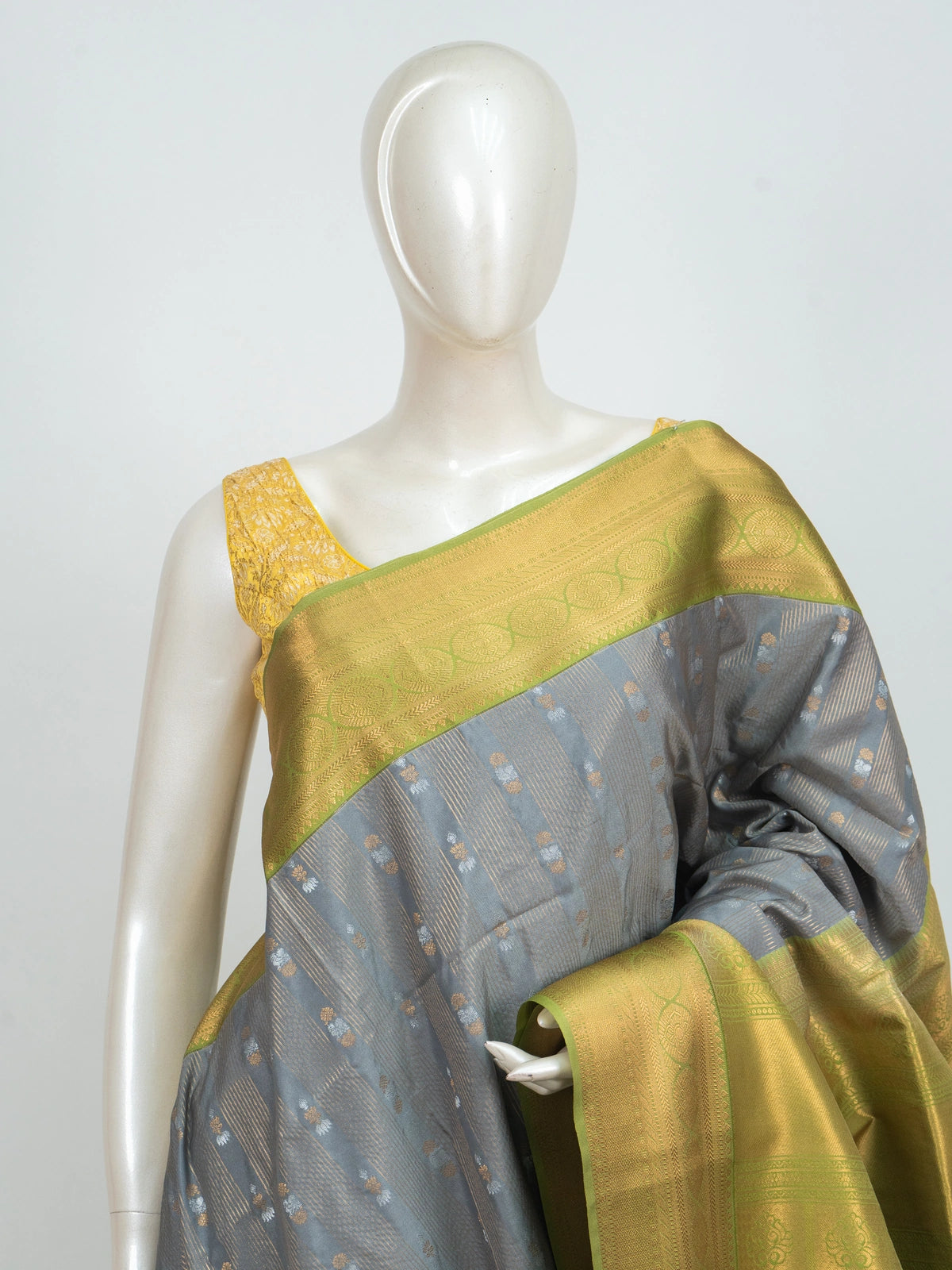 Grey Kanchipuram fancy silk saree with lime green and gold contrast zari border and buttas