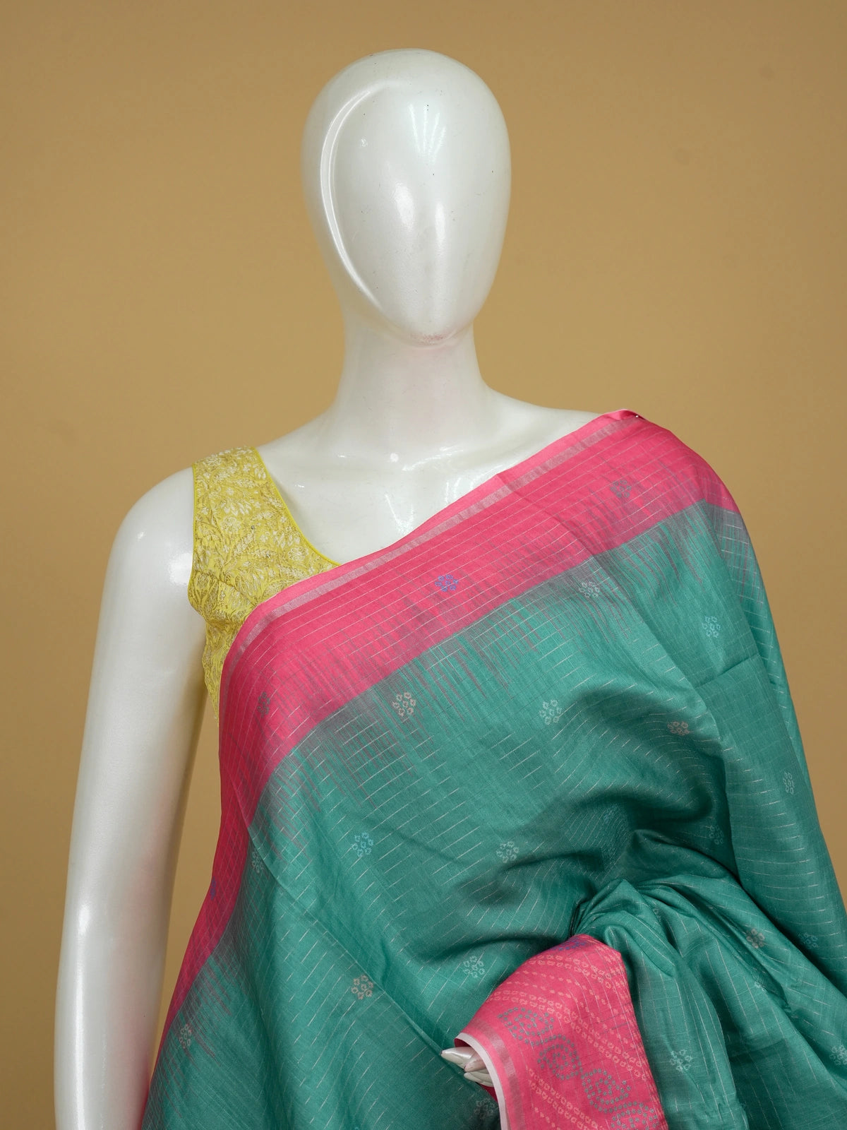 Teal green Dola silk saree with silver zari checks and contrast rani pink border and pallu