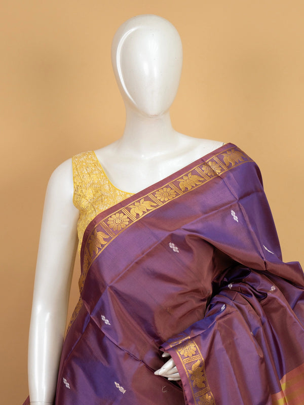 Purple banana silk saree with gold zari lotus border and contrast lime green pallu
