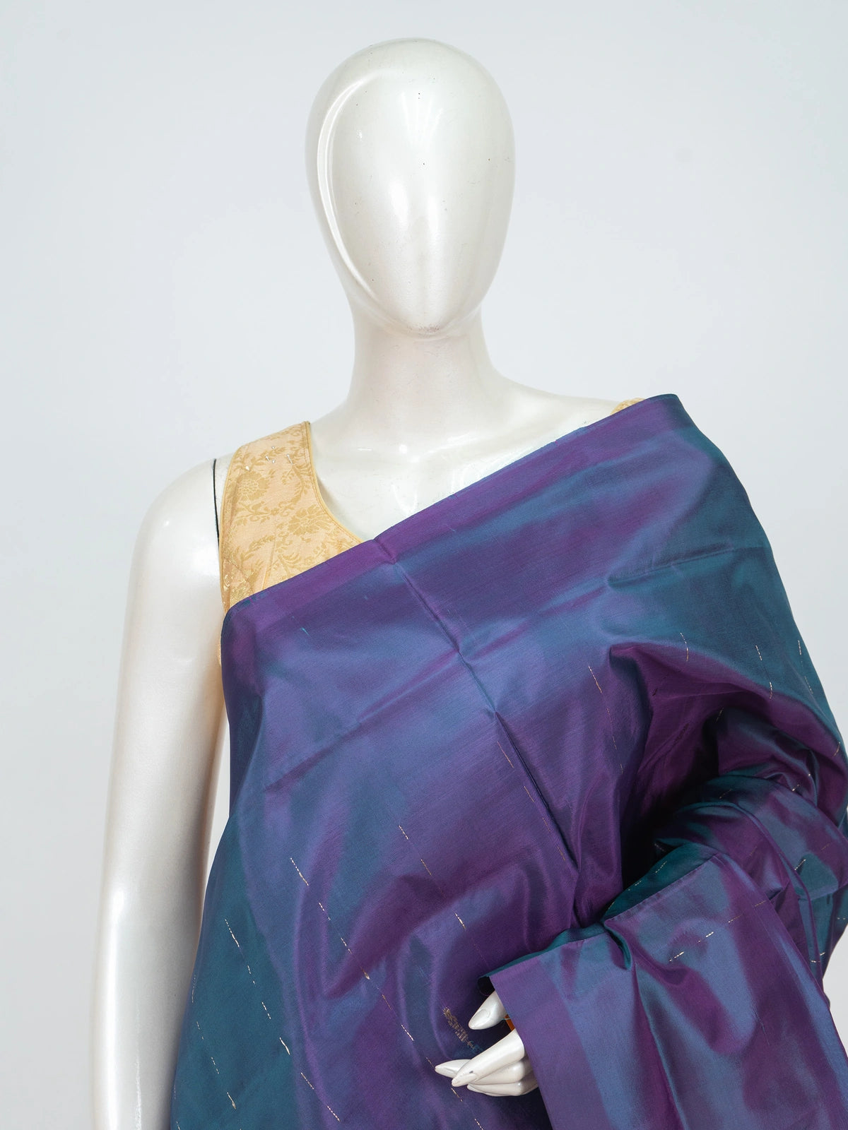 Teal and purple banana silk saree with gold zari stripes and a contrast mustard striped pallu