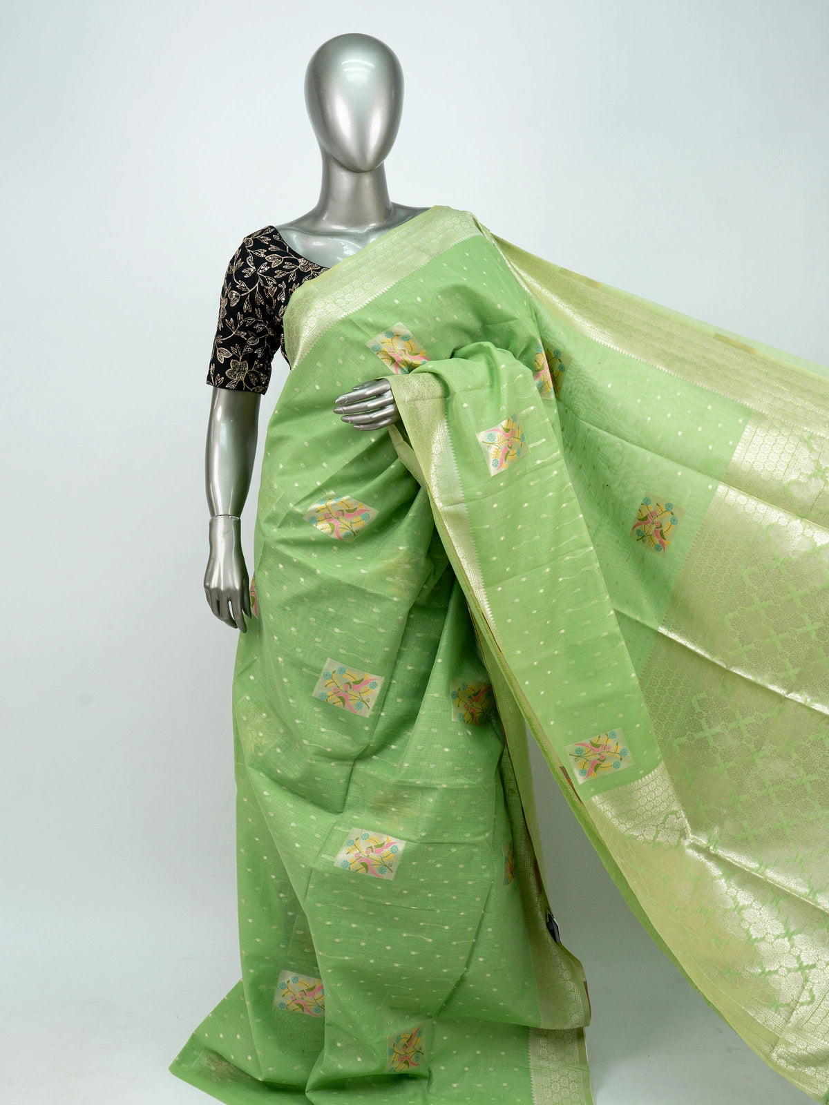 Pista green linen cotton saree with silver zari border and colourful floral buttas