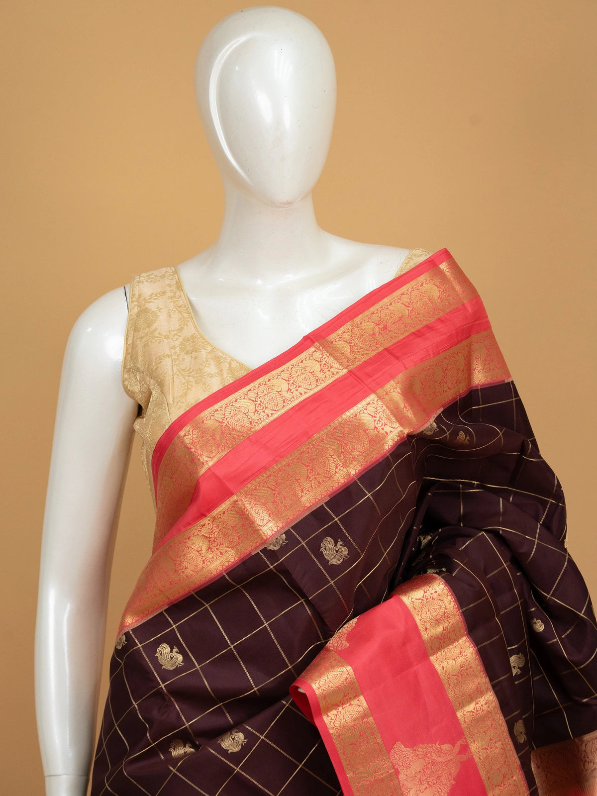 Deep wine pure Kanchipuram silk saree with gold zari checks, peacock motifs and coral pink contrast zari border