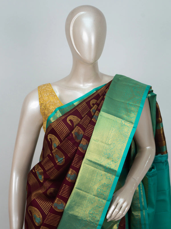 Maroon pure Kanchipuram silk saree with teal green contrast gold zari border and paisley motifs