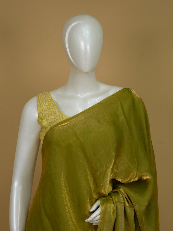 Olive green and gold semi tussar saree with shimmering tissue weave and contrast printed floral blouse