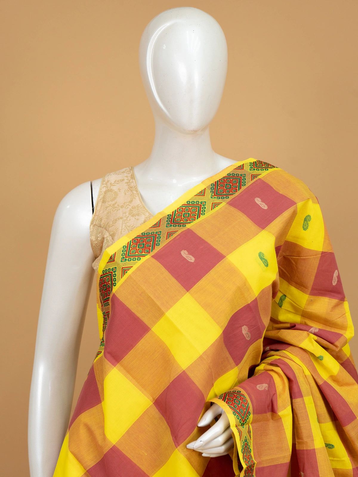 Yellow and red Chettinad cotton saree with checks, paisley buttas and contrast geometric border