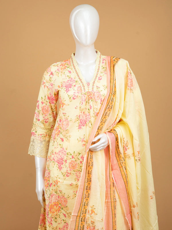 Yellow floral cotton Anarkali kurti set with beaded V-neck, lace cuffs, straight pants, and pink-bordered dupatta