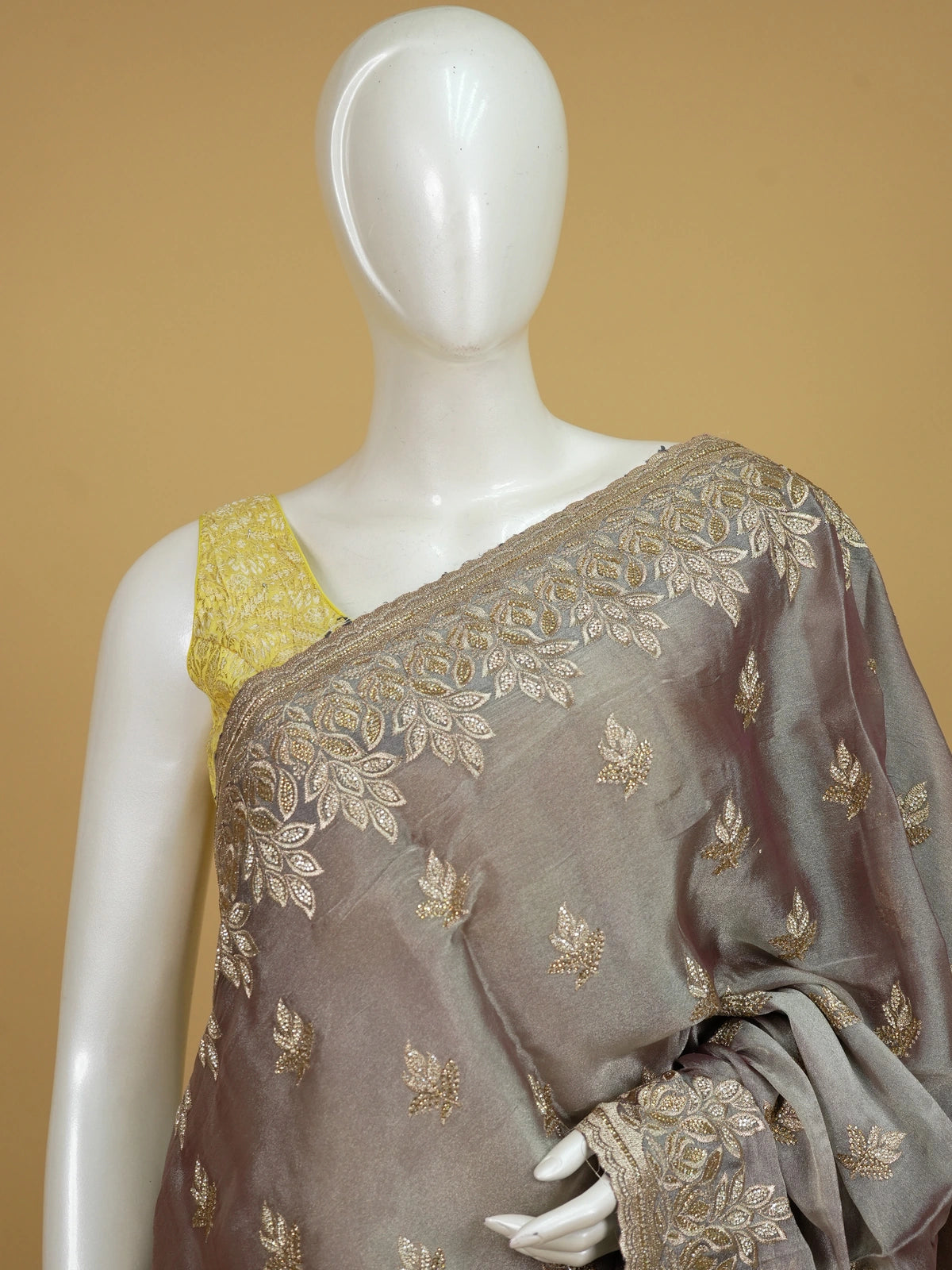 Mauve-grey shimmer designer saree with gold zari and sequin leaf embroidery and scalloped border
