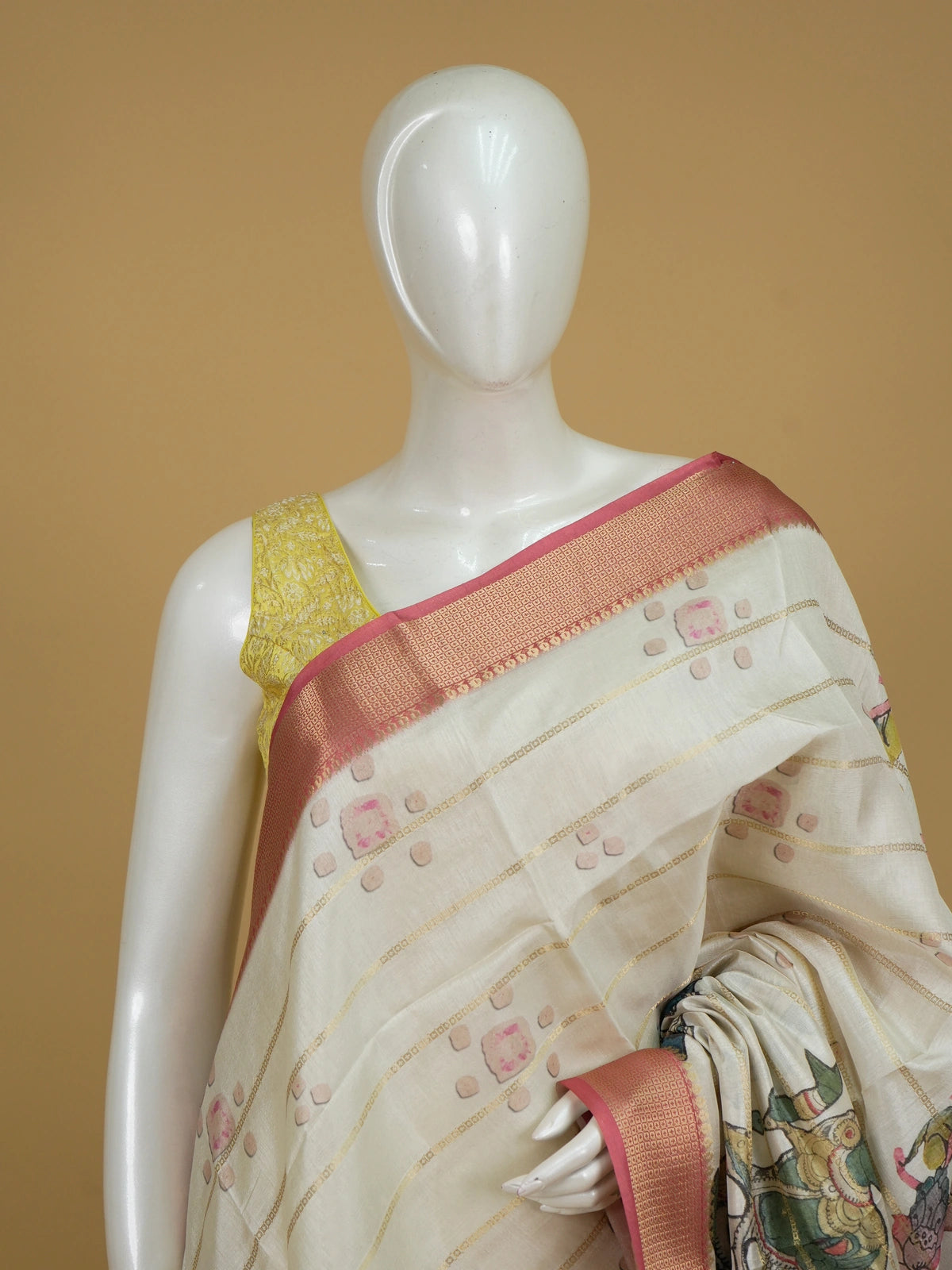 Cream Dola silk saree with pink zari border and Kalamkari peacock-medallion pallu