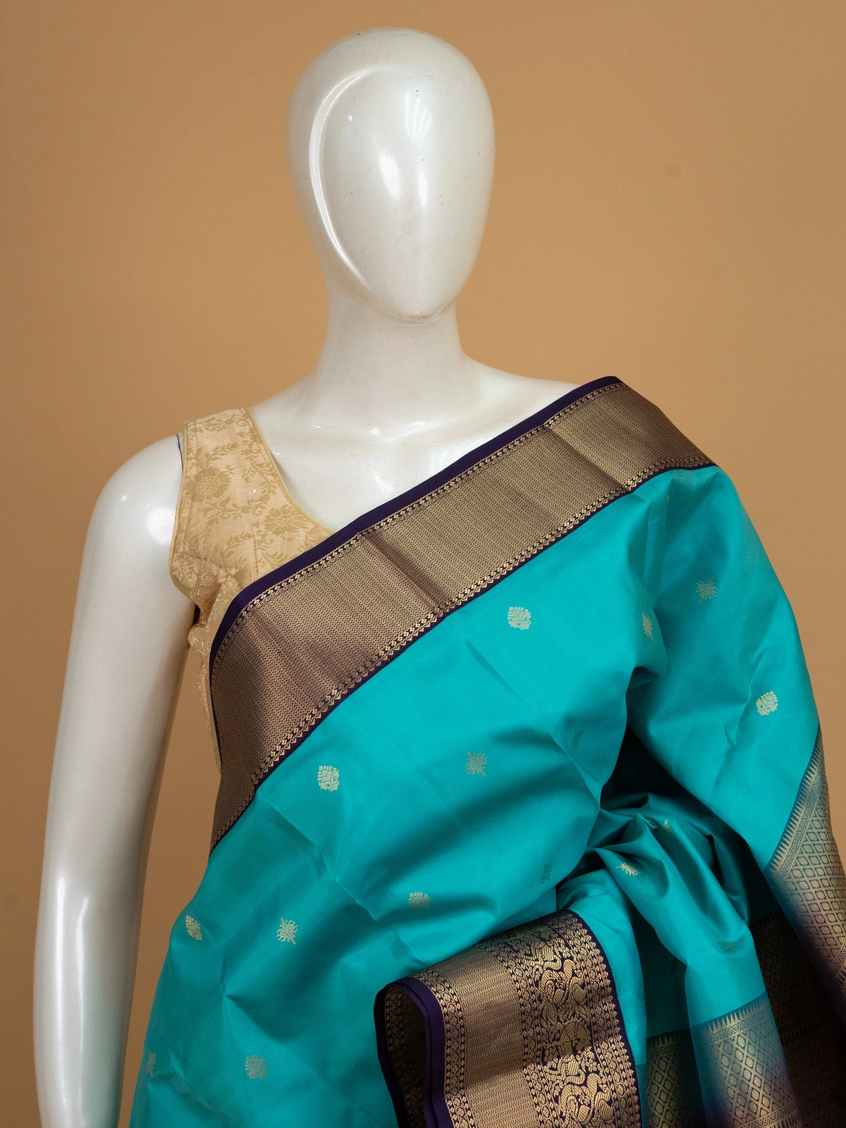 Teal Pure Kanchipuram silk saree with contrast purple and gold zari border and pallu