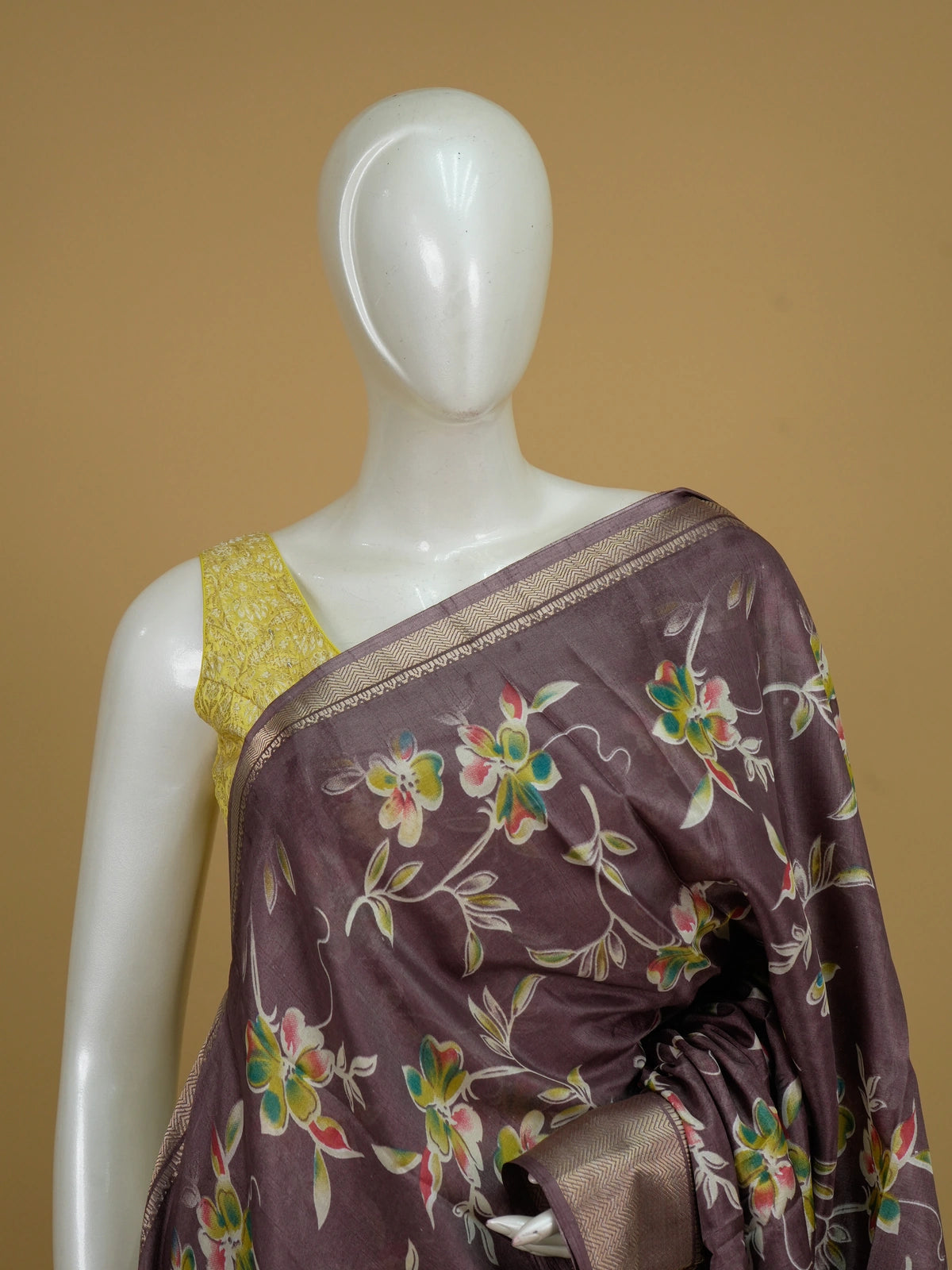 Mauve Dola silk saree with multicoloured floral print, gold zari border and yellow contrast blouse