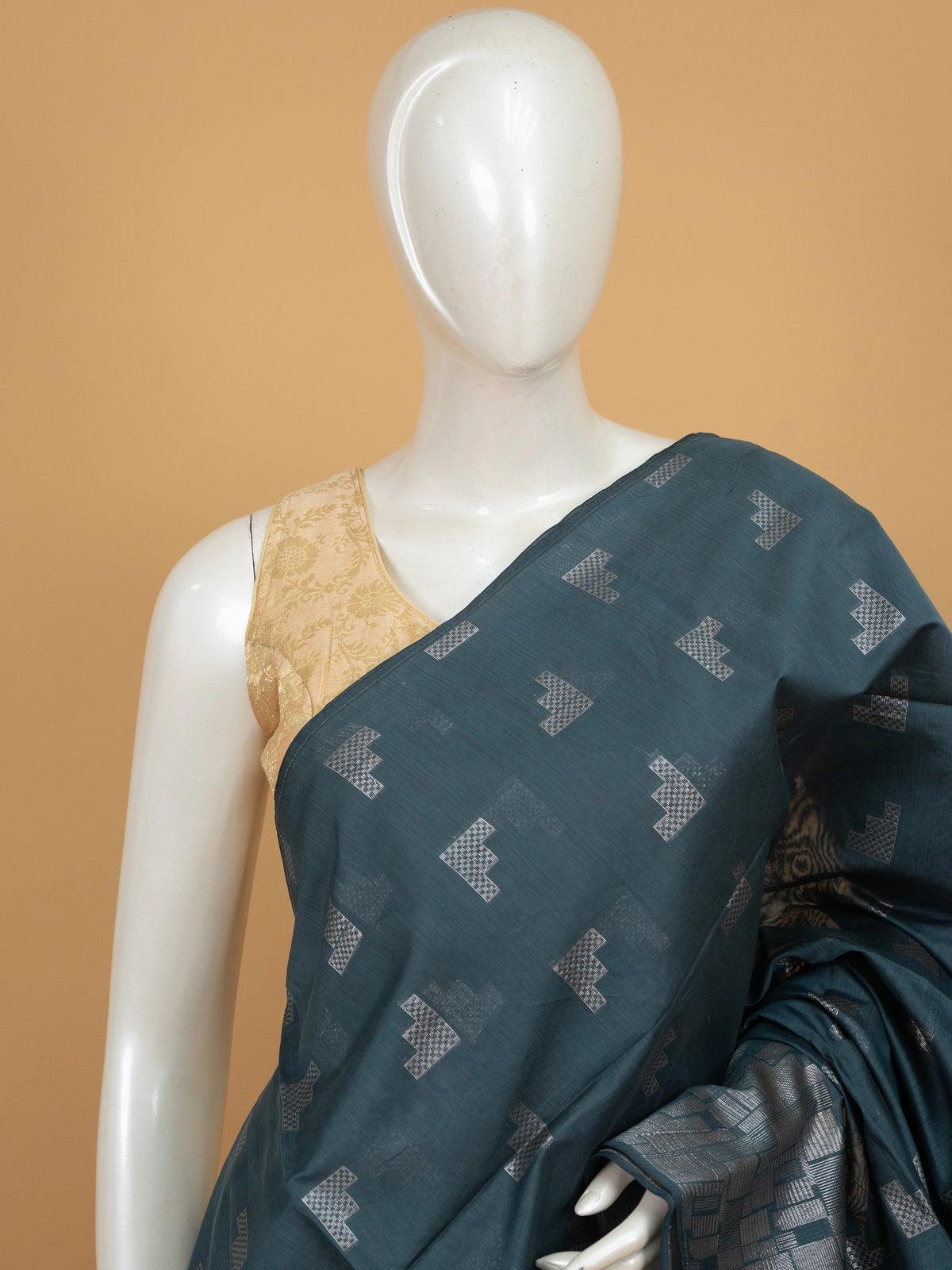 Teal blue silk cotton saree with silver zari geometric motifs and patterned pallu